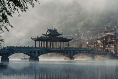 Bridge over river against sky