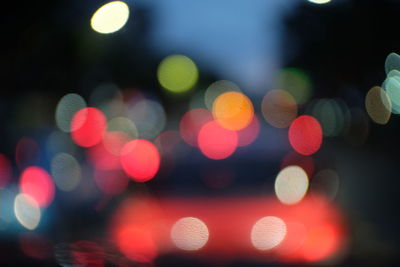 Defocused image of colorful illuminated lights at night