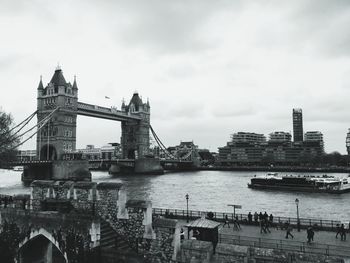 View of bridge over river against cloudy sky