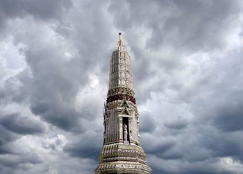 Low angle view of tower of building against cloudy sky