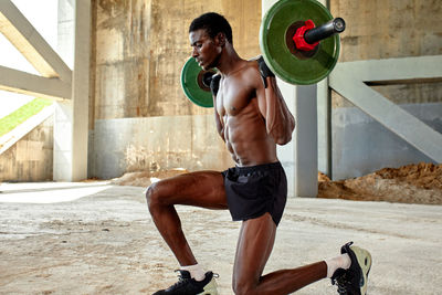 Low section of woman exercising in gym