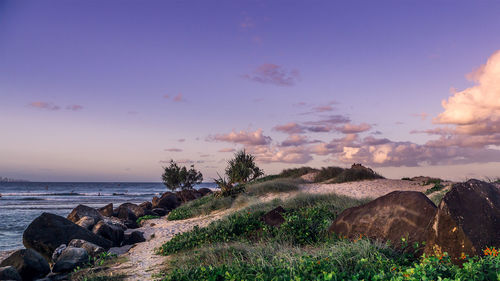 Scenic view of seashore against sky during sunset