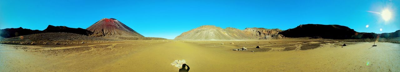 Panoramic view of desert against sky