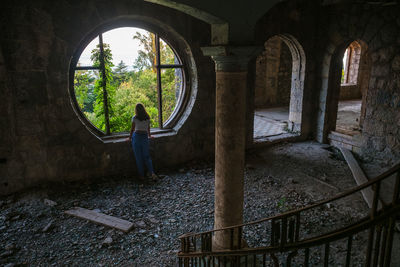 Man standing in old abandoned building