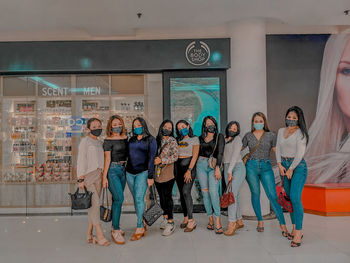 Group of people standing against wall