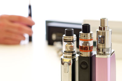 Close-up of electronic cigarettes on table