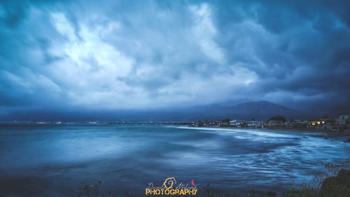 Scenic view of sea against cloudy sky