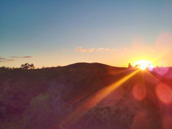 Scenic view of landscape against sky during sunset