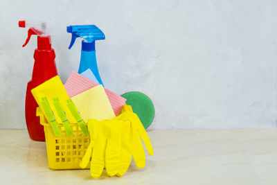 Cleaning equipment on table against wall