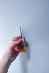 Close-up of hand holding ice cream