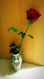 Close-up of rose flower vase on table