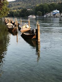 Boats moored in lake