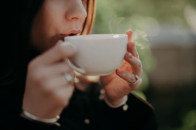 Close-up of woman drinking coffee