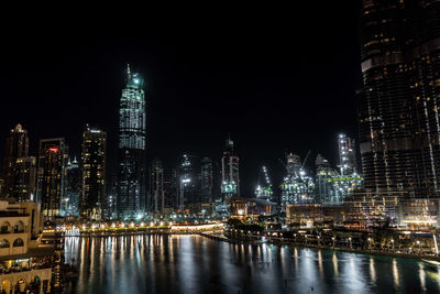 Illuminated buildings in city at night