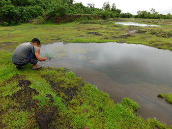 Side view of man in lake