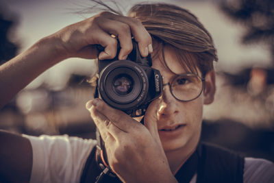 Close-up of woman photographing