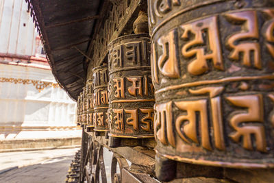 Close-up of text on building outside temple