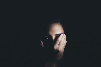 Close-up of young woman looking away
