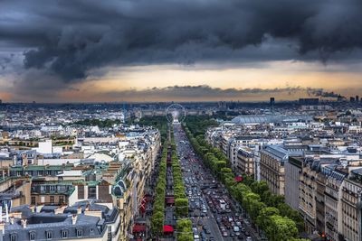 High angle view of cityscape against cloudy sky