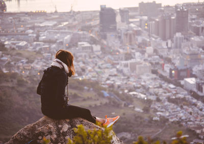 Close-up of woman standing on bench