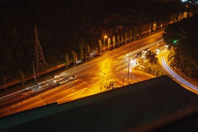 High angle view of light trails on road at night