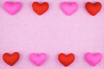 Close-up of heart shape on pink background