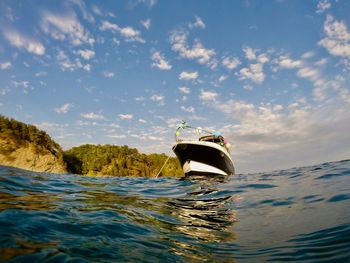 Boat in sea against sky