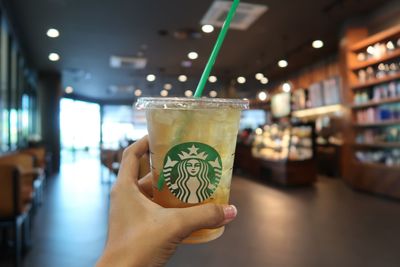 Close-up of hand holding drink