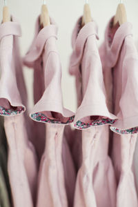 Pink dresses hanging on coathanger