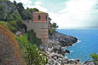 Scenic view of sea against cloudy sky