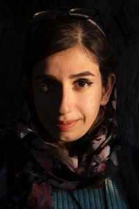 Close-up portrait of smiling young woman