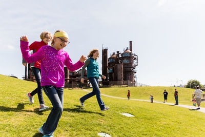 Girl playing on grassy field