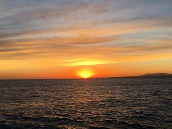 Scenic view of sea against sky at sunset