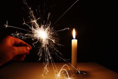 Low angle view of fireworks display at night