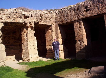 Rear view of man standing by historic building