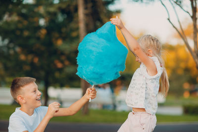 Rear view of mother and daughter outdoors