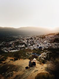 Scenic view of cityscape against sky during sunset