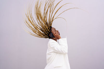 Man looking away against white background