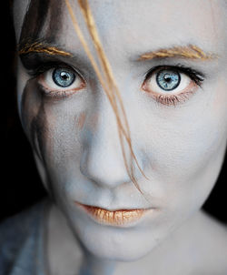 Close-up portrait of young woman with make-up