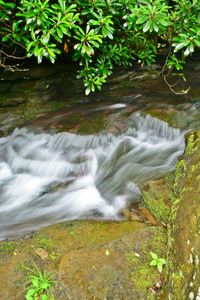 Scenic view of river flowing through rocks