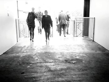 Full length of woman standing by railing