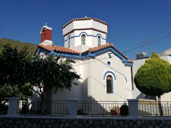 Low angle view of church against clear blue sky