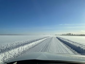 Road seen through car windshield