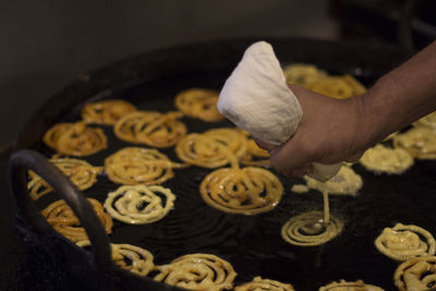 Close-up of man preparing food