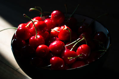 High angle view of cherries in bowl on table