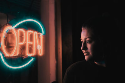 Portrait of woman with illuminated text