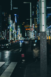 Illuminated city street at night