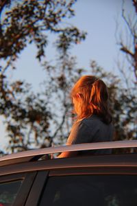 Rear view of woman against sky