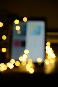 Defocused image of illuminated lights at night