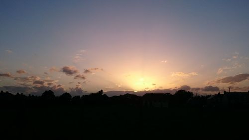 Silhouette landscape against sky during sunset